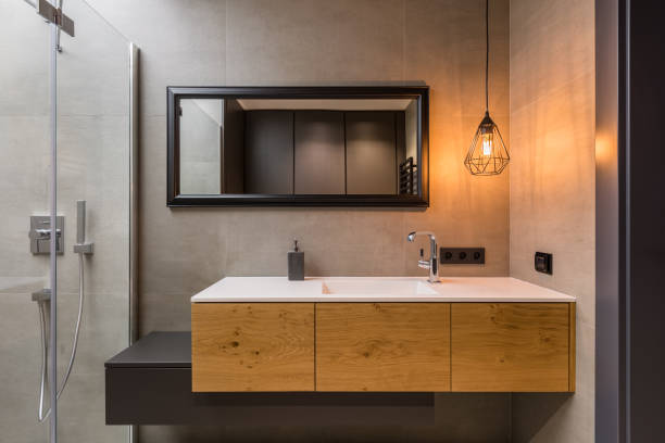 light dimmer in an Integral countertop sink on wooden cabinets in contemporary bathroom