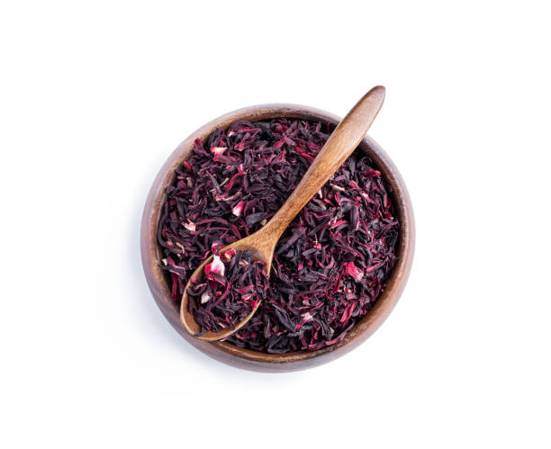 Dried  red hibiscus tea in wooden bowl 