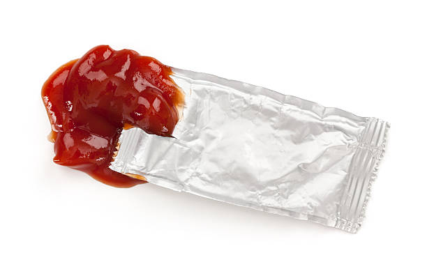 Open ketchup packet | istock