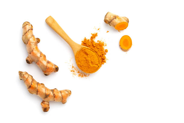Turmeric powder and turmeric root isolated on white background  