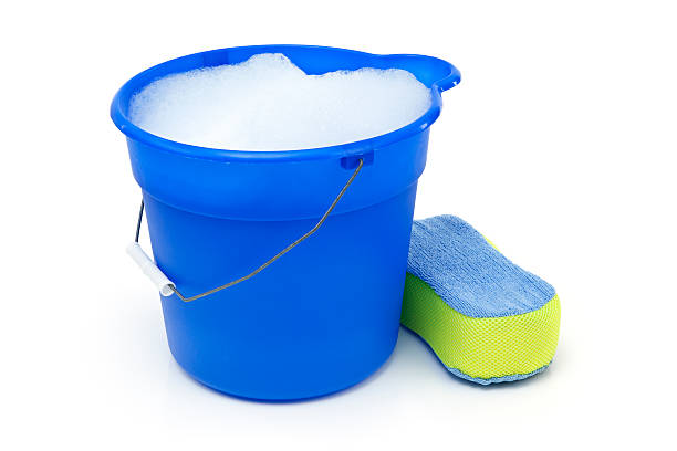 cleaning Blue bucket with soap