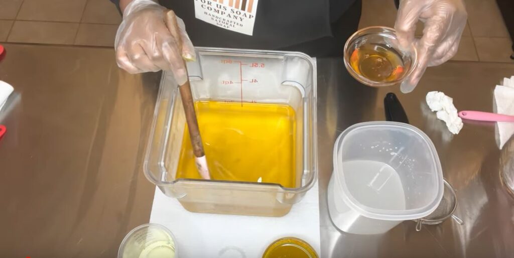 Adding Honey inside the oil in a measuring container